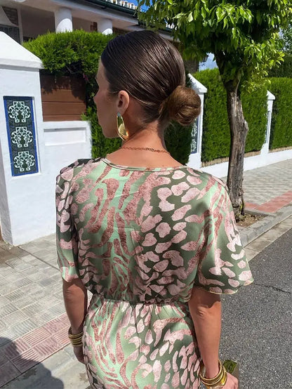Solène V-neck elegant dress - model wearing, outdoor lifestyle | Vireza Boutique